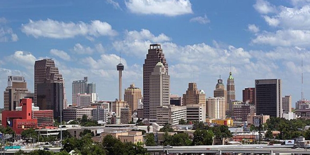 San Antonio skyline at sunset with the Tower of the Americas and River Walk